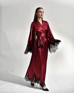 Irresistible in its classic cut, the silk kimono robe with lace embellishments exudes passion. Crafted from silk and satin blend, it features a dramatic, long sweeping hem and draped sleeves, creating a captivating silhouette reminiscent of old Hollywood glamour. The broad obi-style sash draws the waist for a polished profile, making it the epitome of sophistication and a luxurious start to every morning. ✓ garment length - 147 cm/58'' ✓ wrap over style ✓ two sets of inside ties ✓ wide obi-tie i Evening Robe With Satin Finish, Long Evening Robe With Satin Finish, Evening Kimono With Satin Finish, Evening Kimono With Satin Finish And Kimono Sleeves, Long Silk Robe For Wedding Night, Satin Robe With Kimono Sleeves For Evening, Evening Satin Robe With Kimono Sleeves, Elegant Floor-length Satin Kimono, Elegant Satin Robe With Kimono Sleeves