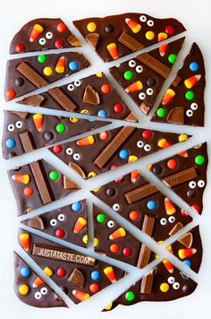 chocolate barkle with candy eyes, googly eyes and candies on it in the shape of a heart