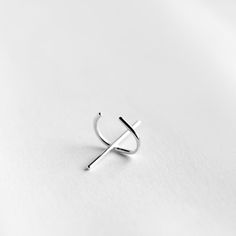 Handmade solid sterling silver ear cuff. Each earring consists of a cuff with a perpendicular bar. Dimensions: 20x12mm Width: 1mm Sold: Individually or as a pair * Suitable for non-pierced ears. Visit my shop: http://www.etsy.com/shop/jewelrymirta © MIRTA Modern Open Ring Ear Cuff As Gift, Modern Single Ear Cuff Open Ring, Silver Single Earring Open Ring, Minimalist White Gold Sterling Silver Cartilage Earrings, Silver Single Open Ring Earring, Minimalist White Gold Single Ear Cuff, Modern Single Open Ring Ear Cuff, Minimalist Single Ear Cuff As Gift, Silver Single Ear Cuff Open Ring