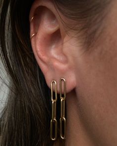 If you love the link style chain, then you'll love the Lola Link earrings! They are 14k gold filled and measure 1.5" Sold as a pair. Hypoallergenic 14k Gold Dangle Jewelry, Sterling Silver Link Earrings For Everyday, Oval Link Metal Earrings For Gift, Metal Oval Link Earrings For Gift, Nickel-free 14k Gold-filled Gold-tone Jewelry, Minimalist Dangle Box Chain Jewelry, Hypoallergenic Gold Linear Earrings In Sterling Silver, Minimalist Dangle Jewelry With Box Chain, Hypoallergenic Yellow Gold Linear Earrings For Everyday