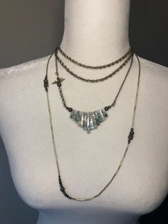 This beautiful piece is your perfect layering necklace that will standout and is one of a kind! There are three separate necklaces that can be styled with all three, just two or even each separately depending on the look you're going for. The vintage silver rope chain twist necklace can be wrapped or worn as one long strand. The vintage moss agate baguette style beads create a unique, stylish, and interesting piece with a subtle bird bead to create the perfect accent. The third necklace is a dai Metal Lariat Jewelry For Layering, Layered Multi-strand Metal Jewelry, Metal Beaded Chain Necklaces For Layering, Metal Jewelry With Beaded Chain For Layering, Metal Beaded Chain Jewelry For Layering, Metal Beaded Chain Necklace For Layering, Silver Lariat Necklace With Satellite Chain, Silver Beaded Chain Necklace For Layering, Silver Satellite Chain Jewelry For Layering