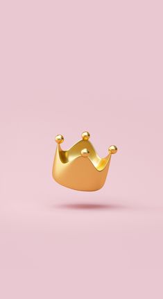 a gold crown on a pink background