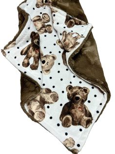 a teddy bear blanket with polka dots on the bottom and brown bears on the back