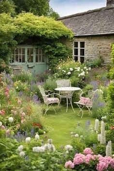 the garden is full of flowers and chairs