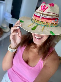 Introducing the Taganga Colombia Hat, a stunning Summer Straw Hat that captures the essence of tropical elegance. Ideal for sun-soaked days, this Panama Hat is crafted from raffia, making it a durable and eco-friendly choice. It's not just a Womens Sun Hat; it's a statement of artisan craft. This handmade straw hat stands out with its gorgeous embroidered design, with fringes, tassels and beads. It’s more than just a beach hat; it's a piece of wearable art that blends tradition with style. As a Summer Fedora Panama Hat Made Of Palm Leaf, Adjustable Bohemian Panama Hat In Palm Leaf, Handwoven Fedora Panama Hat For Vacation, Handwoven Fedora Panama Hat For Beach, Handwoven Fedora Panama Hat For Beach Season, Handwoven Toquilla Straw Hat For Beach, Summer Handwoven Fedora For Vacation, Summer Style Handwoven Fedora For Vacation, Tropical Short Brim Hats For Summer