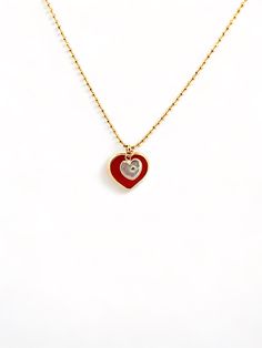 Give the special mom and daughter in your life an elegant and exclusive reminder of their bond with this gorgeous Mommy and Me Heart Necklace. Two delicate hearts, one in luxurious red and the other crafted from mother of pearl, hang from a dainty gold chain for a beautiful mother-daughter accessory. The perfect gift for an unforgettable bond. Dainty Gold Chain, Seashell Painting, Valentines Day Presents, Mom And Daughter, Pink Moon, Heart Locket, Gold Coins, Recycled Fabric, Ball Chain