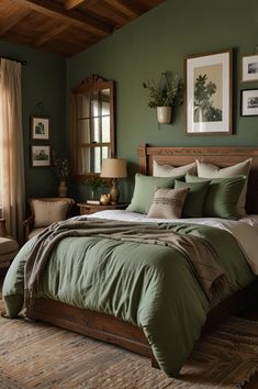 a bedroom with green walls and bedding in the center, along with pictures on the wall