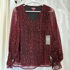 Vince Camuto Women’s Metallic Balloon-Sleeve Blouse (Brand New, Dark Wine, Xs) Polish Your Denim Look Or Update Your Night-Out Ensemble With This Stunning Top With Stylish Shimmer. * V-Neck * Long, Sheer Balloon Sleeves With Ruffled Cuffs * Lined * Metallic/Polyester; Lining: Polyester Condition: Brand New (Still Has Its Tags) Red Long Sleeve Blouse With Blouson Sleeves, Red Blouse With Blouson Long Sleeves, Holiday Long Sleeve Fitted Blouse, Fitted Long Sleeve Holiday Blouse, Holiday V-neck Blouse For Night Out, Red Long Sleeve Tops For Party Season, Red Long Sleeve Party Top, Chic V-neck Holiday Tops, Festive Long Sleeve Winter Blouse