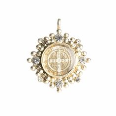 Exquisitely crafted to perfection, the Cloister collection from Virgins Saints & Angels draws inspiration from centuries of spirituality, superstition, and the allure of good fortune. Fashioned from plated bronze and encased in resilient resin, our classic San Benito Charm Medallion pays homage to Saint Benedict, a beacon of peace and unwavering conviction. This timeless medallion, designed for versatility, can be effortlessly attached to our chains or beaded necklaces, allowing you to personali Blessing Medallion Charms Jewelry, Spiritual Coin-shaped Charms Jewelry, Spiritual Coin Charms Jewelry, Spiritual Coin Charm Jewelry, Spiritual Jewelry With Antique Finish, Spiritual Medallion Jewelry With Si Clarity, Bronze Pendant Jewelry For Blessings, Spiritual Antique Gold Jewelry With Antique Finish, Antique Gold Jewelry For Blessing