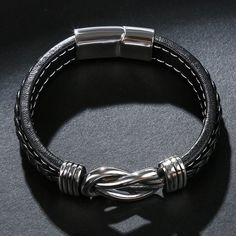 Bold and unique, this bracelet makes an adorable gift for people who are looking for a men's bracelet. Crafted in titanium steel, the bracelet shows a unique and pristine look. Just take this handsome design. It won't disappoint you! Material: Titanium SteelPlating Color: Silver Modern Braided Bracelets With Stainless Steel Clasp, Modern Braided Bracelet With Stainless Steel Clasp, Minimalist Silver Braided Bracelet With Stainless Steel Clasp, Adjustable Silver Stainless Steel Braided Bracelet, Father's Day Silver Leather Bracelet, Father's Day Silver Leather Bracelet Gift, Father's Day Gift Silver Leather Bracelet, Minimalist Silver Leather Bracelet, Minimalist Silver Metal Leather Bracelet