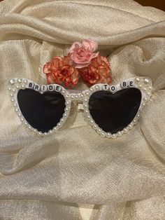 Personalised Bride Sunglasses - Heart shaped white pearl sunglasses with custom design letter beads and pearl bling. Perfect gift-accessory for the bride/ groom/ bachelorette/ bachelor/ hen party/ wedding/honeymoon. Each pair of glasses is custom made. Pearls are placed by hand and will be different with each pair.   If you have any questions please feel free to send a message ♥  Since every one of our products is custom-made, unfortunately we do not accept returns or exchanges. Bride Sunglasses, Pearl Sunglasses, Personalized Bride, Wedding Honeymoon, Party Bachelorette, Letter Beads, Hen Party, Gift Accessories, Lettering Design