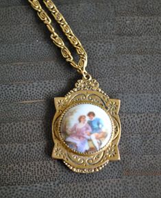 ***This vintage  necklace is made with a porcelain  pendent .(LIMOGES LOOK )***Porcelain is hand painted with a picture of a couple. ***Swirl design on the chain. Comes with extra extension chain. ***Entire necklace is 24.75' long. (untied.) Extension link alone is 5'' long. ***Pendent is just over 1'' long. Vintage Hand Painted Round Pendant Necklace, Vintage Hand Painted Necklaces For Gift, Vintage Hand Painted Necklace As Gift, Hand Painted Vintage Necklace As Gift, Vintage Hand Painted Pendant Jewelry, Hand Painted Vintage Necklace For Gift, Vintage Hand Painted Pendant Necklace, Vintage Hand-painted Pendant Necklace, A Picture Of A Couple