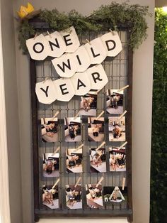 an old window is decorated with photos and letters that spell out the word one wild year