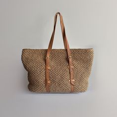 Discover the perfect blend of elegance and functionality with our handmade straw tote. This versatile bag is designed to be your go-to accessory for any occasion. Key Features: -Hand-woven straw body: Natural, rustic look with durability -Genuine leather straps: Adds sophistication and comfort -Adjustable shoulder strap: Customizable carry options -Suede leather accents: Luxurious touch -Quality inner lining: Keeps your belongings secure Spacious Interior:Comfortably fits your daily essentials, electronics, books, or beach gear. Versatile Design: Perfect for office, picnics, city tours, or beach outings. Why You'll Love It: Handcrafted with care High-quality materials ensure longevity Timeless design complements any outfit Practical for everyday use Balances fashion and function Dimensions Woven Light Brown Bags For Vacation, Light Brown Woven Bags For Vacation, Light Brown Woven Shoulder Bag For Travel, Travel Light Brown Woven Shoulder Bag, Light Brown Travel Shoulder Bag With Braided Handles, Chic Light Brown Straw Bag For Beach, Light Brown Shoulder Bag With Braided Handles For Travel, Chic Light Brown Straw Bag For The Beach, Light Brown Shoulder Beach Bag For Vacation