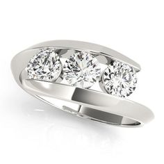 three stone diamond ring on white background