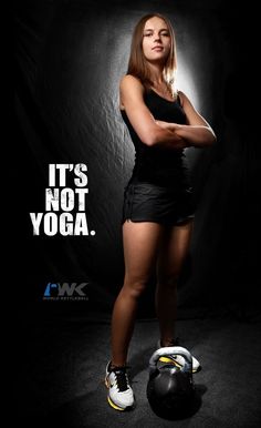 a woman posing with her arms crossed in front of a black background and the words, it's not yoga