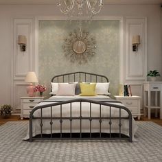 a bed room with a neatly made bed and a chandelier