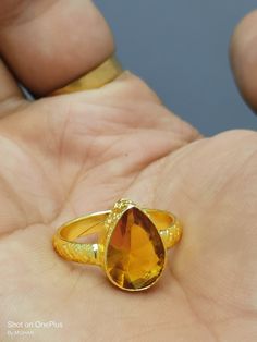 Yellow sapphire, also known as "Pukhraj" in Hindi, is a gemstone that belongs to the corundum family, just like blue sapphire. It is the yellow variety of corundum and is valued for its vibrant yellow color. Yellow sapphire is composed of aluminum oxide (Al2O3) with traces of iron that give it its yellow hue. The color of yellow sapphire can range from pale yellow to intense golden yellow. The most prized and valuable yellow sapphires typically exhibit a pure, vibrant yellow color without any hi