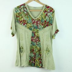 Vintage 90s/Y2K green multi embroidered rayon top. It is a free size style but it seems like a modern S/M depending on desired fit. There are some light spots on fabric, looks like part of the dye process but not sure. Please see all photos for condition and check the measurements for size. Shoulders 17" Sleeve 9 1/2" Chest 40" Length 25" CF Multicolor V-neck Top With Floral Embroidery, Green V-neck Tops For Festival, Festival Floral Print V-neck Top, Bohemian Short Sleeve Patchwork Blouse, Green V-neck Hippie Top, Casual V-neck Top With Multicolor Embroidery, Green Short Sleeve Blouse With Patchwork, Bohemian Multicolor Embroidered V-neck Top, Casual Free Size V-neck Tops