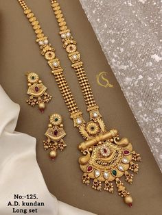 Description :- Wedding Long Necklace Sets - With Earrings Mother's Day gifts - Gift For Her - Neclace For Women - Minimalist Jewelry - Birthday Gift Gift yourself a royal look with this perfectly crafted kundan necklace set from Manalisstudio. Crafted with high quality kundan stones and pearls, it is impressive in design. The green enamel artwork adds perfect texture to the design. Perfect for weddings and festivities, this antique necklace set should be put on with your favorite sari or lehenga Gold Jewellery Necklace Design, Long Gold Set Designs, Traditional Jewelry For Valentine's Day Celebration, Simple Gold Jewelry For Wedding, Elegant Jewelry With Simple Design For Valentine's Day, Elegant Simple Jewelry For Valentine's Day, Gold Plated Jewelry Sets For Wedding On Valentine's Day, Intricate Dangle Jewelry For Anniversary, Anniversary Jewelry With Intricate Dangle Design