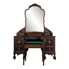 an antique wooden vanity with mirror and stool