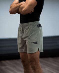 Summer Training Bottoms With Built-in Shorts, Athletic Shorts With Built-in Shorts For Gym, Functional Short Swim Trunks With Built-in Shorts, Stretch Khaki Shorts For Outdoor, Green Athletic Shorts With Built-in Shorts, Elastic Waistband Athletic Shorts For Training, Casual Squat Proof Sports Shorts, Sportswear Shorts For Outdoor, Khaki Athletic Shorts With Built-in Liner