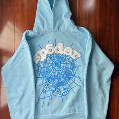 Brand New Xl Baby Blue Sp5der Hoodie Never Been Worn I Ordered The Wrong Size Message Me For Offers Blue Cotton Hoodie With Graphic Print, Blue Hoodie With Drawstring For Streetwear, Blue Hoodie Sweatshirt For Streetwear, Trendy Blue Hoodie With Graphic Print, Light Blue Letter Print Sweatshirt For Fall, Oversized Light Blue Cotton Hoodie, Blue Letter Print Sweatshirt For Winter, Light Blue Graphic Print Sweatshirt For Winter, Blue Hooded Sweatshirt For Streetwear