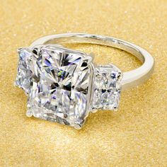 14K Gold 5ct Radiant-cut Moissanite Three-Stone Engagement Ring | Earthena Jewelry Bold Engagement Rings, 25 Anniversary Rings, Engagement Ring 3 Stone, Ring 3 Stone, Gold Moissanite Ring, Radiant Ring, Prong Ring, Bridal Engagement Rings, Rings Engagement