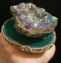 This is an older piece from my inventory which I am just now getting around to listing. I affixed a green titanium druzy geode with a gray crystallized interior onto a green Brazilian agate. The ring measures 3.25" x 3" with a height of approximately 1". This is a double band ring which will adjust to fit most, if not all. The mounts are wide, secure, comfortable and antique gun metal or deep silver tone shade. A great unisex styled statement ring from the Atelier of Kat Kouture! Unique Healing Gemstone Geodes, Healing Gemstone Geodes, Unique Healing Geodes, Unique Geodes For Healing, Large Agate Geode For Spiritual Purposes, Large Agate Geode For Spiritual Use, Unique Round Gemstone Geodes, Unique Geodes Gemstone Gift, Large Spiritual Geode Gift