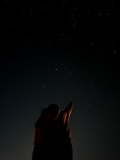 two people looking up at the stars in the sky