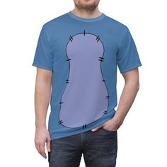 a man wearing a blue t - shirt with an image of a cartoon character on it