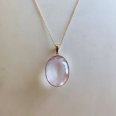 ITEM DESCRIPTION: >>The pendant is made from Solid 14K Yellow Gold. Gemstone used is absolutely natural and ethically sourced. >>Natural Rose Quartz in bezel setting is studded on it with utmost precision. >>This is a minimalist design and is absolutely hassle-free and everyday jewelry. Gem: Rose Quartz Gem size: 15.5x21.5 mm Gem weight: 14.5 carats Gold purity: 14K (58.33% approx.) Gold weight: 0.63 grams Gross weight: 3.60 grams The Gold purity is guaranteed and it comes with authentic 14K gol Elegant Pink Gold Jewelry With Bezel Setting, Fine Jewelry Faceted Gemstones For Gift, Faceted Gemstones For Gifts, Fine Jewelry Style, Faceted Gemstones For Gifts - Fine Jewelry, Faceted Gemstones For Fine Jewelry Gifts, Elegant Oval Gemstones For Gifts, Elegant Faceted Gemstones In 14k Gold, Rose Gold Gemstones For Gifts, Fine Jewelry, Rose Gold Fine Jewelry Gemstones As Gifts