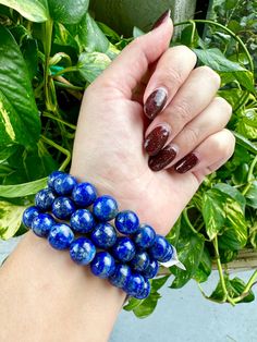 🌟 Welcome to Shine Bright Crystals! 🌟 Stay updated on our newest arrivals and exciting giveaways by following us on Instagram: @ShineBrightCrystals Bracelet will be intuitively chosen for you. 📏 Approximate Bead Size:   11.3mm - 11.5mm Elevate your accessory game with our Lapis Lazuli Bracelet, featuring majestic 11.3mm beads. This luxurious bracelet not only stands out with its deep blue hues and natural golden flecks but also embodies the essence of wisdom, truth, and spiritual enlightenment. A perfect blend of style and soulful energy, it's designed to connect you more deeply with your inner self and the universe. 💙✨  * Regal Design: The 11.3mm Lapis Lazuli beads offer a bold and regal    appearance, making this bracelet a statement piece of jewelry.  * Wisdom and Truth: Lapis Lazul Sapphire Jewelry With 8mm Beads, Blue 108 Beads Bracelet Jewelry, Blue Lapis Lazuli Crystal Bracelet Gift, Blue Crystal Bracelet With Polished Beads As Gift, Blue Crystal Bracelet With Polished Beads For Gift, Blue Lapis Lazuli Beaded Bracelets, Blue Crystal Bracelet With Polished Round Beads, Blue Stretch Bracelet With 8mm Beads For Jewelry Making, Blue Stretch Bracelet With Large Beads