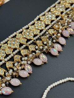 This lightweight and dainty set in thapa kundan or multani work is made of high quality gold plating and has gorgeous pink crystal drops that have an ombre finish. The colors are super unique and pastel so that they can go with any outfit whether its a saree or lehenga! and can be worn separately for a simple look. This lightweight and elegant necklace is perfect for any bridesmaid, bride, sangeet or any occasion or event as a gift for any occasion as any one who loves jewelry will love this sta String Earrings, Simple Look, Punjabi Wedding, Authentic Indian, Indian Wedding Jewelry, Elegant Necklaces, Crystal Drop, Bridal Necklace, Pink Crystal