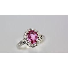 This is part of Chairish’s Fine Jewelry assortment.  Pink Sapphire and Diamond Ring  This Pink Sapphire and Diamond Ring is a gorgeous color of pink. Also, it is set with a Diamond Halo around the stone and Diamonds going down the shank.  This lovely ring is new and weighs 1.20 carats. It is a size 6.5 but can be re-sized no problem.  The color of this Sapphire is amazing true pink. Luxury Pink Ruby Ring In Platinum, Luxury Pink Ruby Ring With Halo Setting, Luxury Pink Ruby Ring For Formal Occasions, Luxury Pink Sterling Silver Rings, Luxury Pink Sapphire Ruby Ring, Luxury Pink Sapphire Rings With Gemstone, Dazzling Pink Sterling Silver Ring, Pink Gia Certified Diamond Ring For Formal Occasions, Gia Certified Pink Sapphire Rings For Formal Occasions