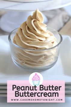 a bowl filled with peanut butter cream on top of a white plate