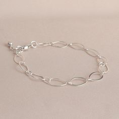 "* Sterling Silver Long Loop Layering Bracelet * * Beautiful sterling silver long loop layering bracelet finished with a sterling silver lobster claw clasp and completed with sterling silver bead. This bracelet 7\" long and is created with 925 sterling silver material and not made with plated materials. * Heart Clay Dish (also sold separately) https://www.etsy.com/listing/1094093610/heart-ring-dish-boho-ring-dish-christmas * This bracelet will arrive in a box tied with a ribbon perfect for gift Adjustable Oval Link Sterling Silver Bracelet As Gift, Everyday Simple Silver Bracelets, Nickel-free Link Chain Bracelet Minimalist Style, Silver Sterling Minimalist Paperclip Bracelet, Elegant Silver Chain Paperclip Bracelet As Gift, Simple Sterling Silver Chain Bracelet For Everyday, Sterling Silver Minimalist Paperclip Bracelet Gift, Nickel Free Sterling Silver Link Bracelet, Everyday Simple Sterling Silver Chain Bracelet