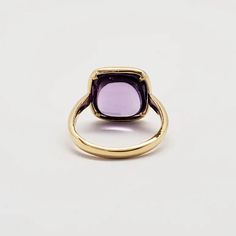 PURPLE PARADISE WHAT IT IS: 18k yellow gold ring with amethyst 9.5 cts WHY IT’S SPECIAL: Exquisite in its design, this ring elevates the concept of simplicity and sophistication to the highest level. Surrounding the finger is an 18k yellow gold band, with a mesmerizing cushion-cut amethyst at its heart. Truly enchanting... GOOD TO KNOW: 18k yellow gold 3.05 gmsAmethyst 9.5 ctsRing Size: 7 WHY WE LOVE DORIAN WEBB: We can't take our eyes off Dorian Webb's purposeful creations that honor women, emb Luxury 14k Gold Purple Rings, Luxury Purple 14k Gold Rings, Timeless Purple 14k Gold Rings, Luxury Solitaire Amethyst Ring, Yellow Gold Amethyst Ring With Center Stone, Yellow Gold Amethyst Ring With Round Cut, Amethyst Yellow Gold Rings Fine Jewelry, Fine Jewelry Amethyst Ring In Yellow Gold, Hallmarked Yellow Gold Amethyst Ring