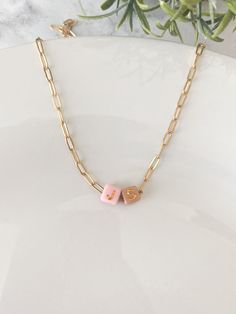 Discover our exquisite Initial Paper Clip Chain Necklace Gold, perfect as a custom name necklace for mom. Our jewelry collection also features a dainty gold layered necklace set adorned with beads ✨Necklace Details✨ - Made of Stainless Steel- Gold Plated - Tarnish Resistant - 18" & 20" length options available - Multicolored Gold Letter Beads Take a look at our other accessories.  https://www.etsy.com/shop/Wild4Style?ref=seller-platform-mcnav 📦Shipping & Packaging📦 All orders will be packaged securely to ensure a safe delivery. Orders will be processed and shipped within 1-7 business days.  If you need it sooner, I provide a rush order option.  RUSH ORDER ADD ON https://www.etsy.com/listing/1717364098/rush-order-add-on-listing?click_key=e548fd443fe262a6e7d55b87615fbaeaee16e2f5%3A17173640 Handmade Gold Necklace For Personalized Gift, Dainty Charm Necklace With Letter Beads For Gift, Dainty Charm Necklaces With Letter Beads For Gifts, Yellow Gold Beaded Necklace For Gift, Mother's Day Jewelry With Initial Pendant And Letter Beads, Gold Necklace With Letter Beads For Jewelry Making, Minimalist Letter Beads Necklace With Round Beads, Customizable Gold Necklace Gift For Mom, Minimalist Letter Bead Necklaces