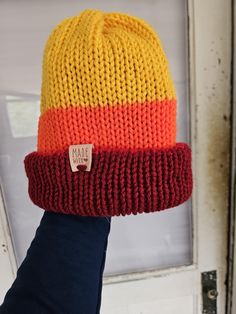 Introducing The Faye Beanie, a vibrant and uniquely designed accessory that combines comfort with style. Elevate your look with this cozy beanie that stands out from the crowd. Trendy Multicolor Winter Beanie, Retro Winter Beanie, Trendy Warm One Size Bonnet, Warm Bonnet For Fall, One Size Fits Most, Funky Winter Hat One Size Fits Most, Trendy Multicolor Winter Hats, Yellow Cotton Beanie Hat, Warm Cotton Hats For Cold Weather, Knitted Bonnet For Fall, One Size