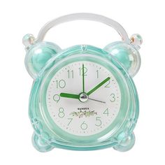 a green and white alarm clock on a white background