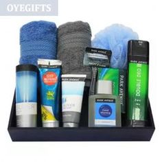 an assortment of men's grooming products displayed in a black tray on a white background