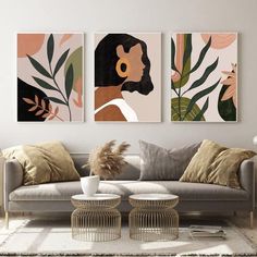 a living room with three paintings on the wall