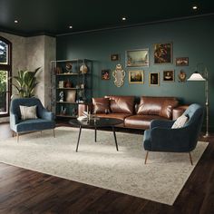 a living room with green walls and leather furniture