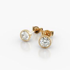 14K Yellow Gold Milgrain Bezel Diamond Stud Earrings (0.50 CTW - H-I / SI1-SI2). This design is the perfect mix of modern and vintage design, crafted to accent the beauty of the round brilliant diamonds with a milgrain bezel and rolled wire basket. This earring will fit slightly off the ear and features friction backs. Classic Everyday Luxury Diamond Earrings With Single Cut, Luxury Yellow Gold Earrings With Bezel Setting, Yellow Gold Cubic Zirconia Earrings With Bezel Setting, Everyday Luxury Round Halo Diamond Earrings, Yellow Gold Diamond Earrings With Bezel Setting, Round Diamond Earrings With Halo Design, Everyday Luxury Round Halo Earrings, Classic 14k Gold Earrings With Bezel Setting, 14k Gold Bezel Set Diamond White Earrings