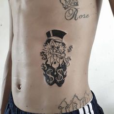 a man with a tattoo on his stomach