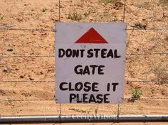 a sign on a fence that says don't steal gate close to it please