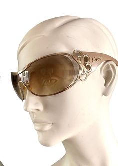 Dior Diori mask sunglasses with taupe resin frames and brown ombre lenses with a gold metal curlicue and the Dior name on the arms. Pre-worn, in very good condition: light scuffing on the lenses but does not impede visibility. Does not come with original case. Made in Italy. Guaranteed authentic. + Vintage items are not new and might have minor imperfections + Will be sent insured and tracked + International orders, PLEASE INCLUDE PHONE NUMBER AND EMAIIL. Buyer is liable for any import duties / Oversized Sunglasses Aesthetic, Y2k Sun Glasses, Shield Glasses, 2000s Sunglasses, Galliano Dior, Mask Sunglasses, Clear Sunglasses, Wrap Sunglasses, Yellow Sunglasses