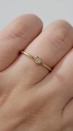 Diamond Heart-Shape Ring, Tiny 2MM Diamond Ring Women, Dainty Minimal Diamond Ring, Promise Ring, 14k Gold Stackable Ring, White, Rose Gold  Made in NYC - Custom Gold Color: Rose Gold, Yellow Gold, White Gold, in 14k  - Shank Width: 1.3mm - Diamond Shape: heart shape  - Number of Stones: 1 - Diamond Size: 2.2 mm - Total CTW:0.04 Ctw   - Diamond Color-Clarity: G-H / SI - Setting Type: Prong Setting  - Finish: high polish  We use only CONFLICT-FREE MINED DIAMONDS. This ring can be made in any ring Valentine's Day Single Diamond Ring In Fine Jewelry Style, 14k Gold Heart Ring With Single Diamond, 14k Gold Solitaire Heart Ring For Promise, Dainty Heart-shaped Stackable Anniversary Rings, Dainty Heart-shaped Stackable Rings For Anniversary, 14k Gold Heart Ring With Single Diamond For Gift, Heart Shaped Single Diamond Ring For Gift, Heart-shaped Single Diamond Ring Gift, Heart Shaped Single Diamond Gift Ring