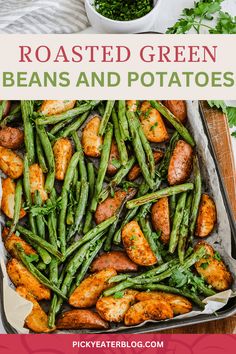 roasted green beans and potatoes in a baking pan on a wooden table with text overlay